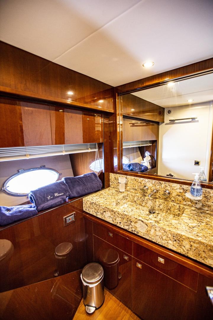 a bathroom with a large mirror aboard LAS BRISAS Yacht for Sale