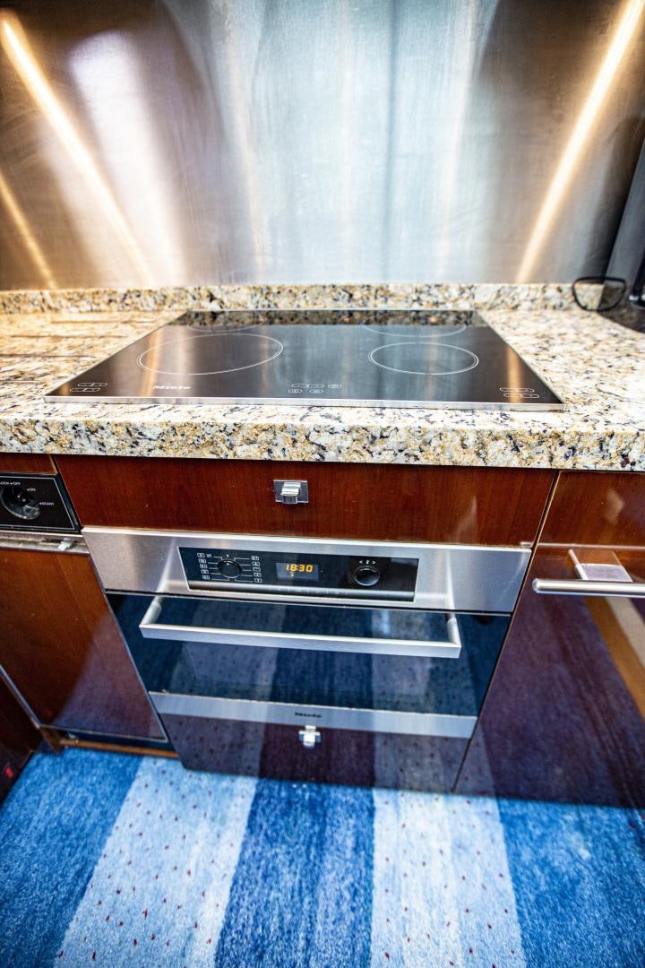 a kitchen with a stove and a sink aboard LAS BRISAS Yacht for Sale