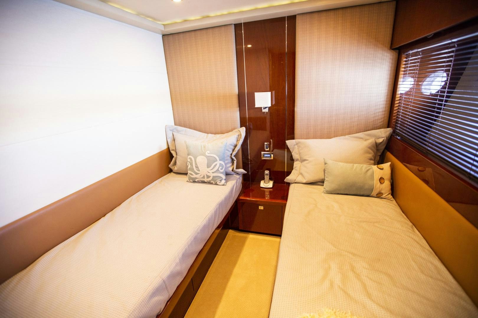a room with a couple beds aboard LAS BRISAS Yacht for Sale