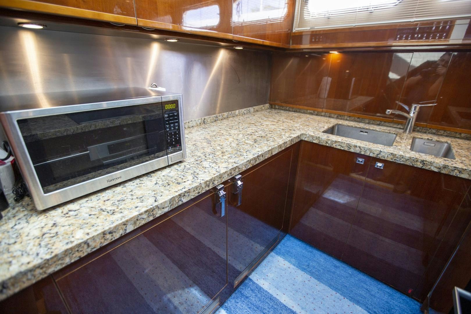 a kitchen with a microwave oven aboard LAS BRISAS Yacht for Sale