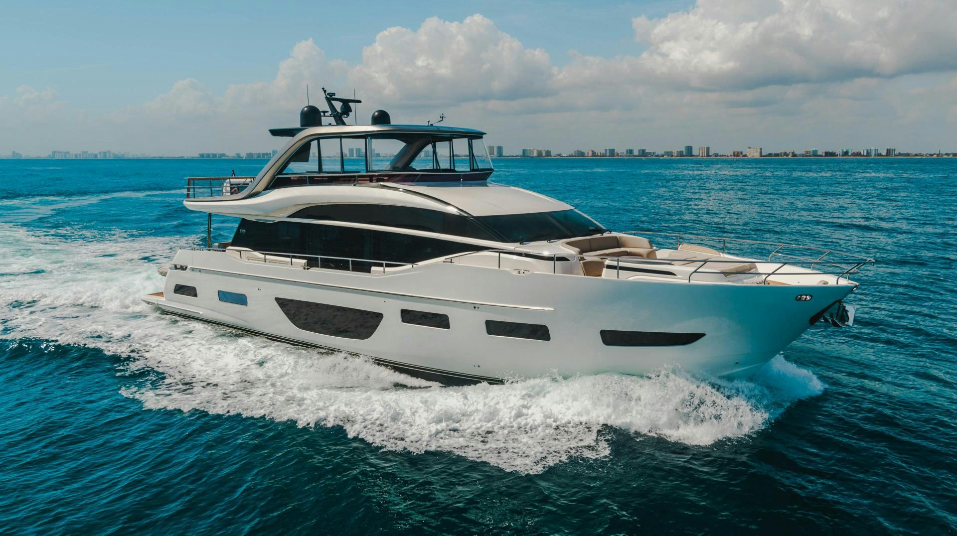 a white yacht on the water aboard KAOS Yacht for Sale