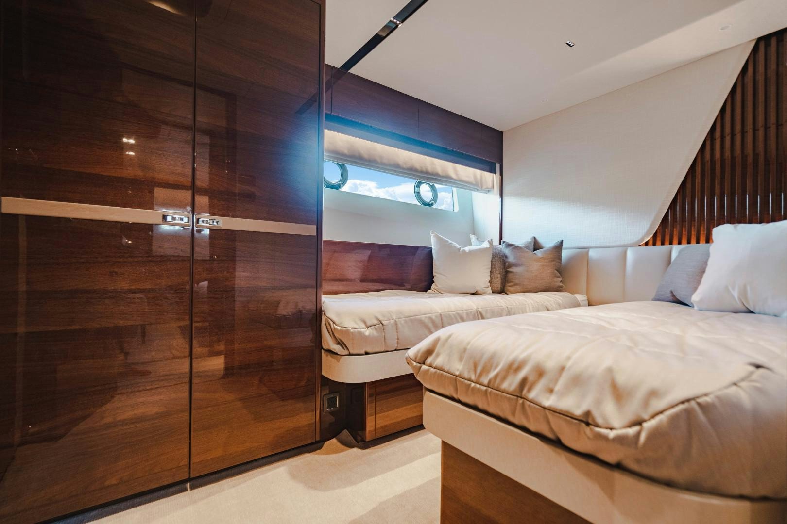 a room with two beds aboard KAOS Yacht for Sale