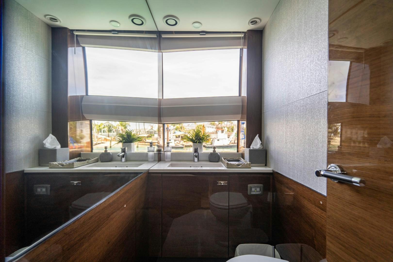 a bathroom with a sink and a toilet aboard KAOS Yacht for Sale