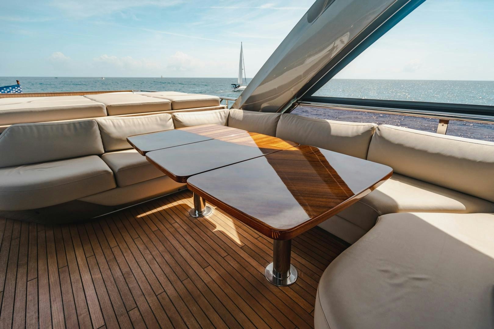 a table on a deck aboard KAOS Yacht for Sale