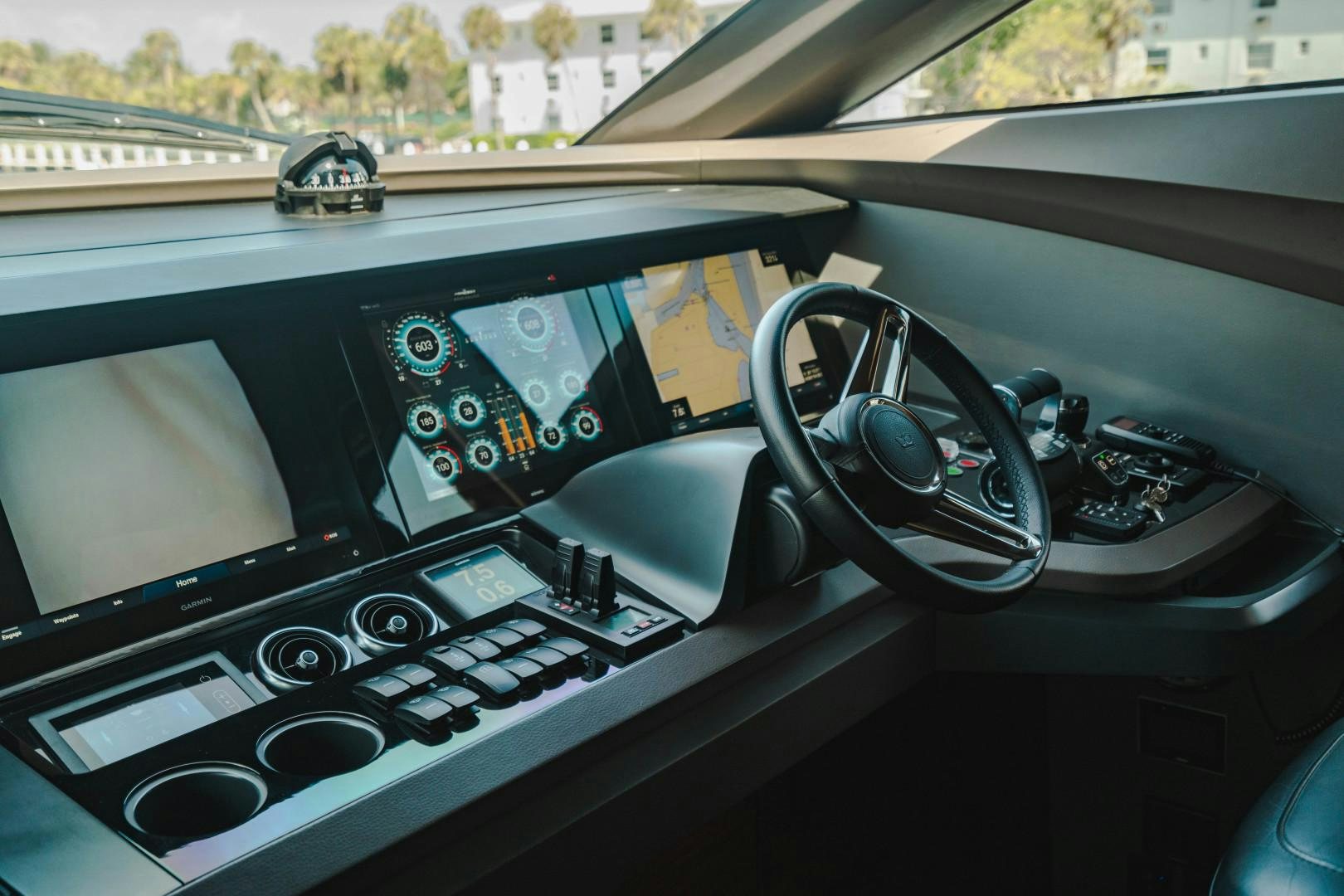 a car with a steering wheel and dashboard aboard KAOS Yacht for Sale