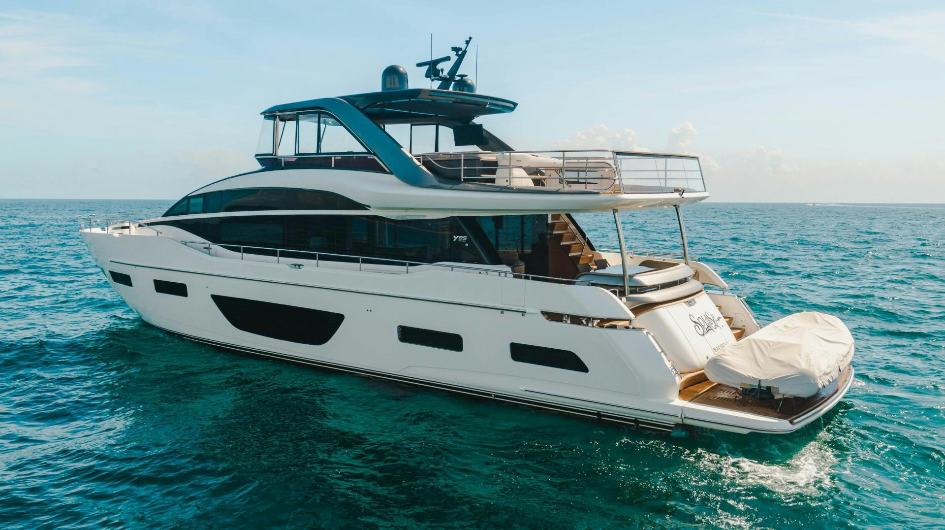 a white yacht in the water aboard KAOS Yacht for Sale