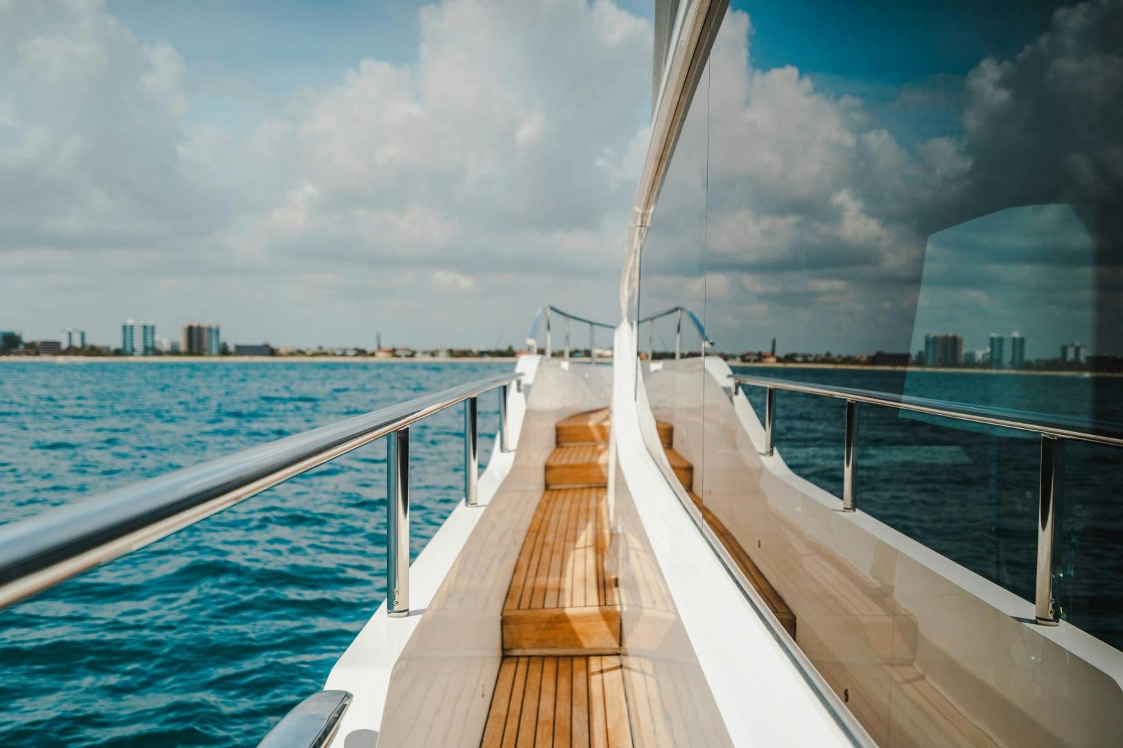 a wooden bridge over water aboard KAOS Yacht for Sale