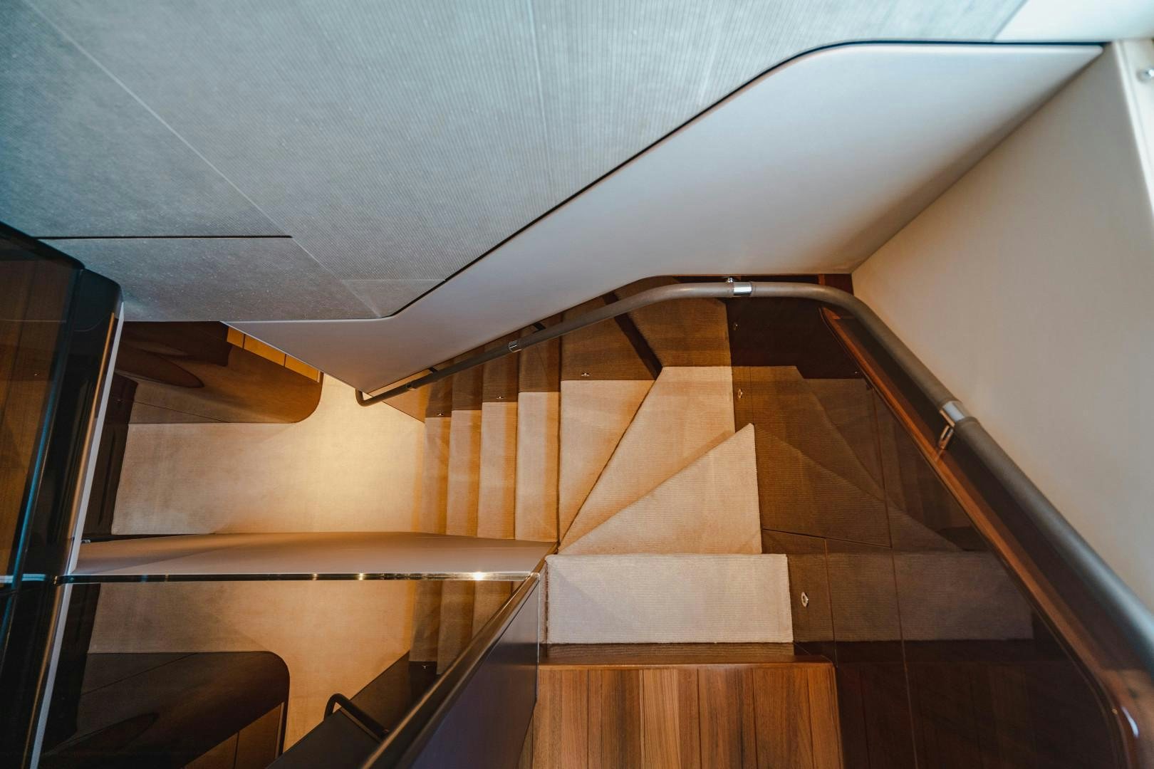 a staircase with a railing aboard KAOS Yacht for Sale