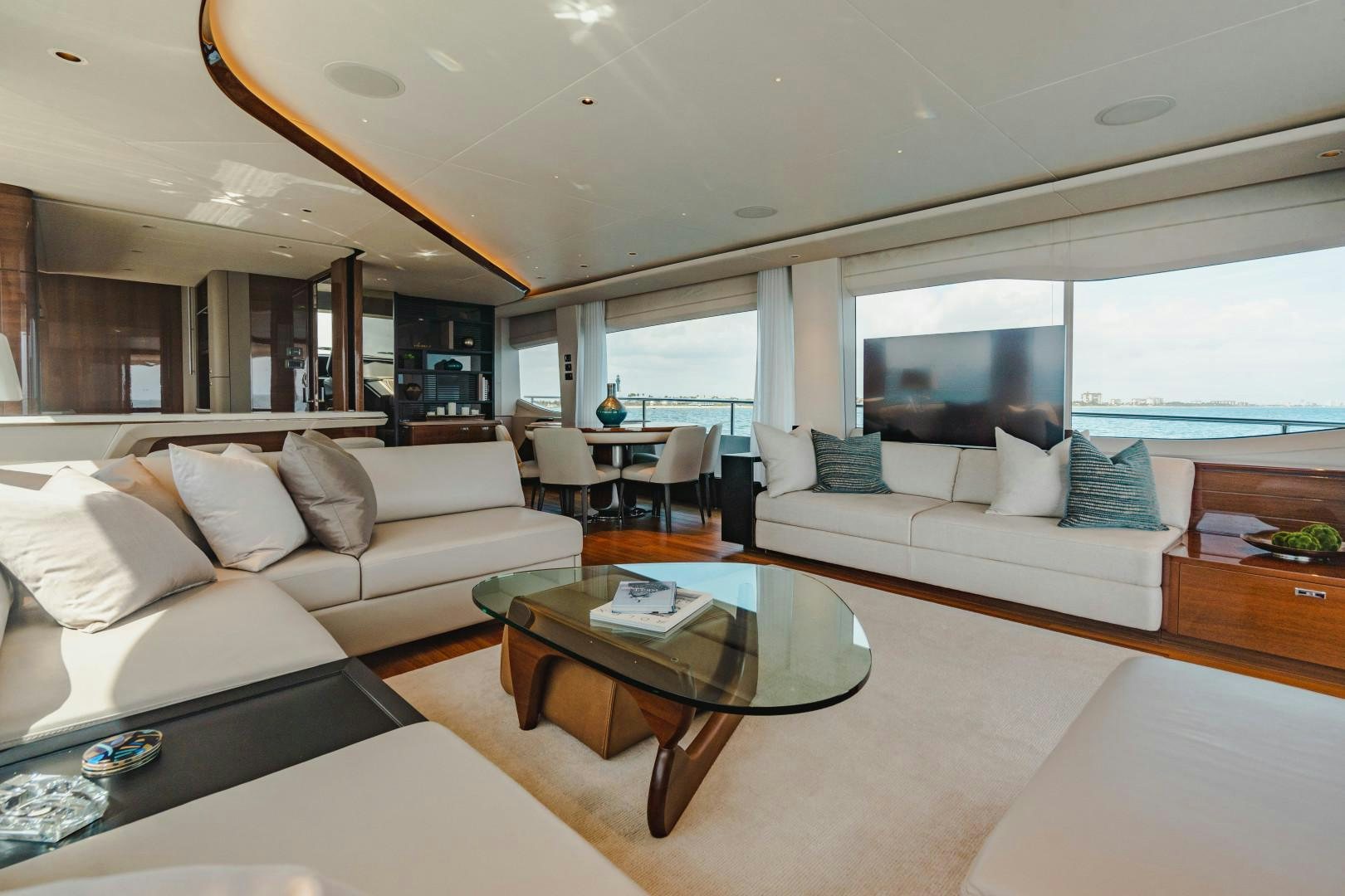 a living room with a couch and a coffee table aboard KAOS Yacht for Sale