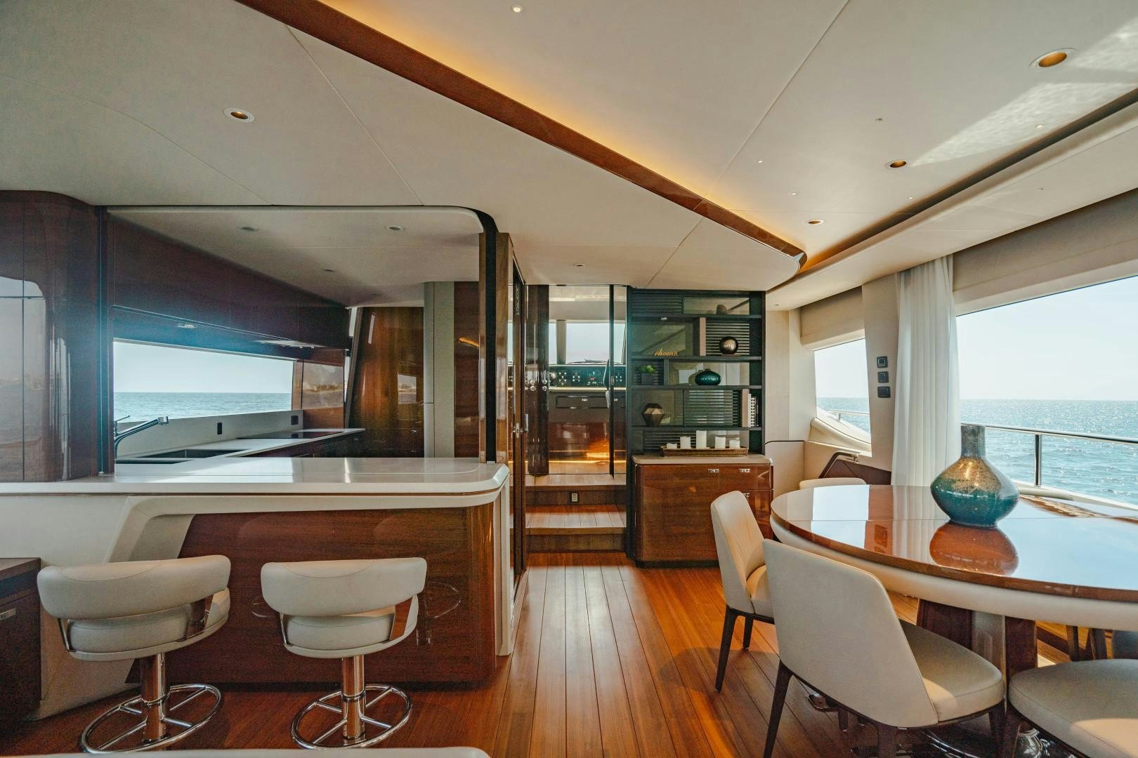 a room with a table chairs and a window aboard KAOS Yacht for Sale