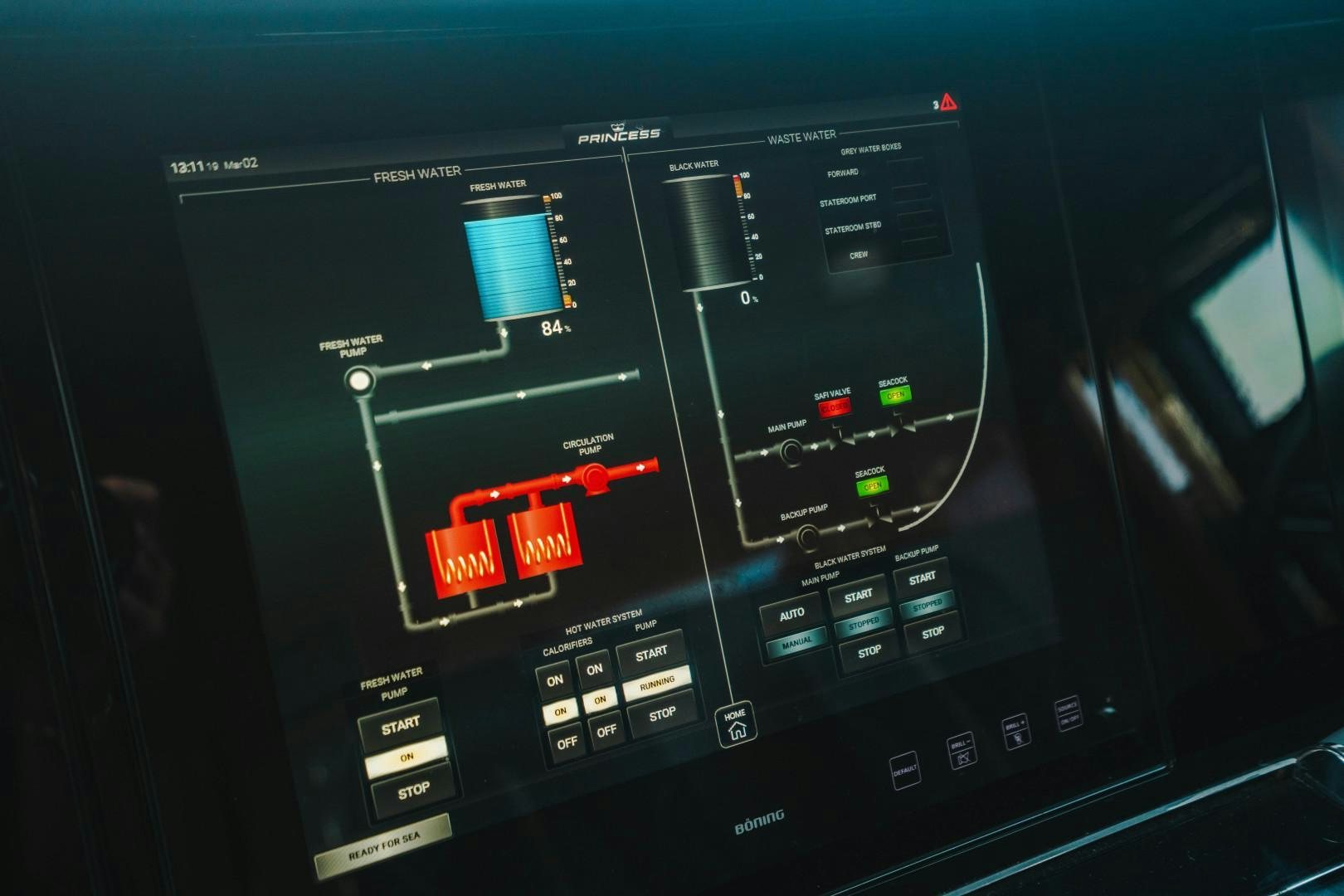 a digital clock showing time aboard KAOS Yacht for Sale