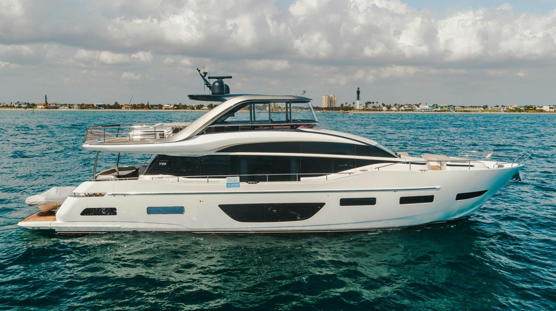 a white yacht in the water aboard KAOS Yacht for Sale