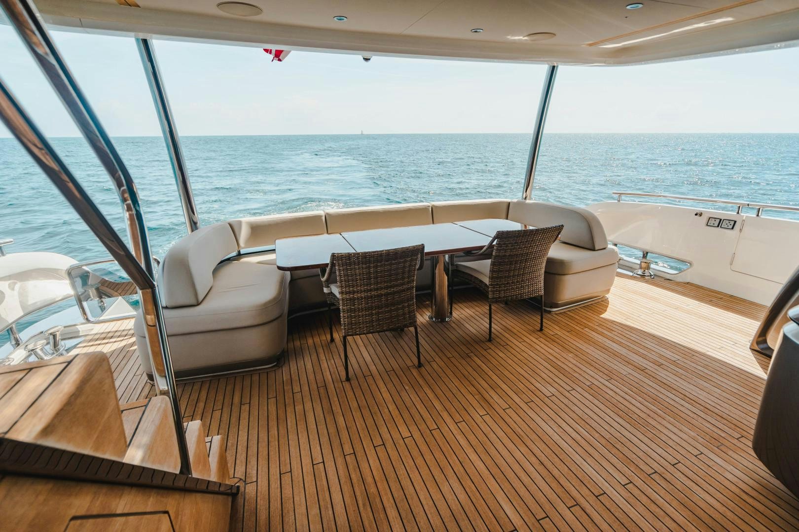 a deck with chairs and tables on it aboard KAOS Yacht for Sale