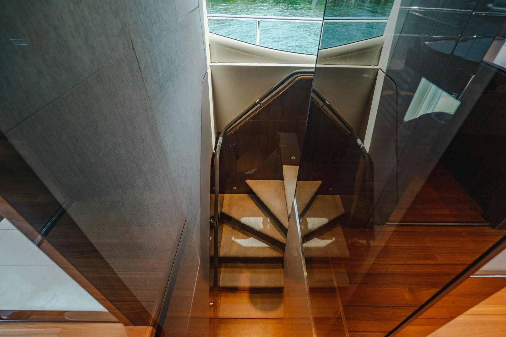 a chair on a wooden floor aboard KAOS Yacht for Sale