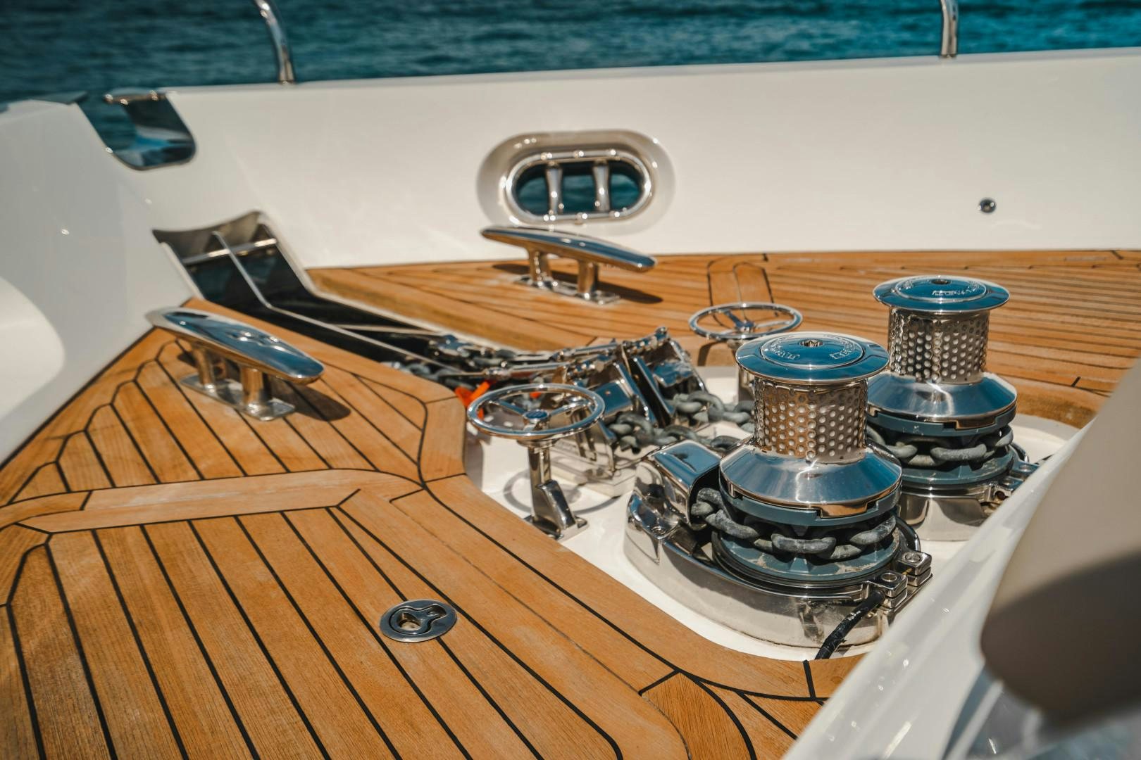 a group of metal drums on a wooden surface aboard KAOS Yacht for Sale