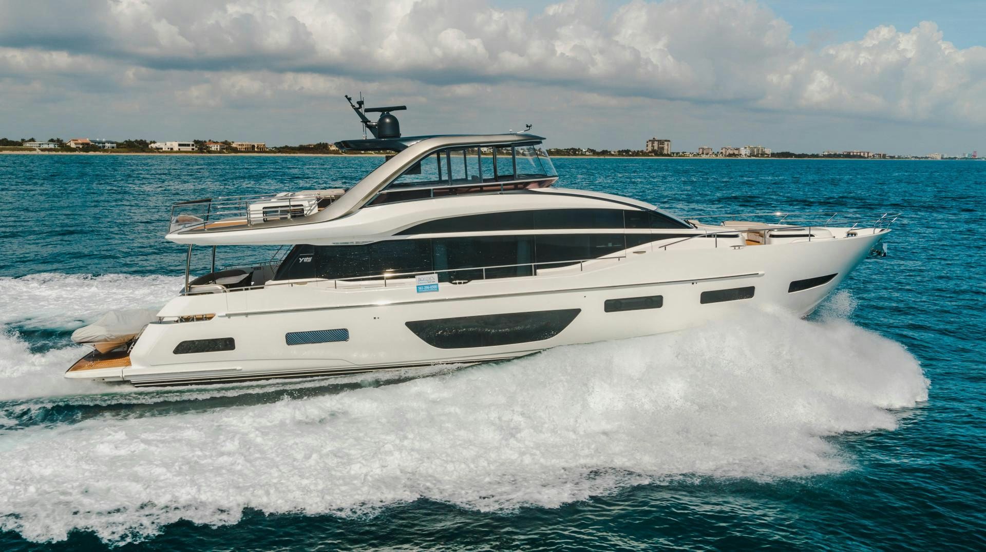 a white yacht on the water aboard KAOS Yacht for Sale