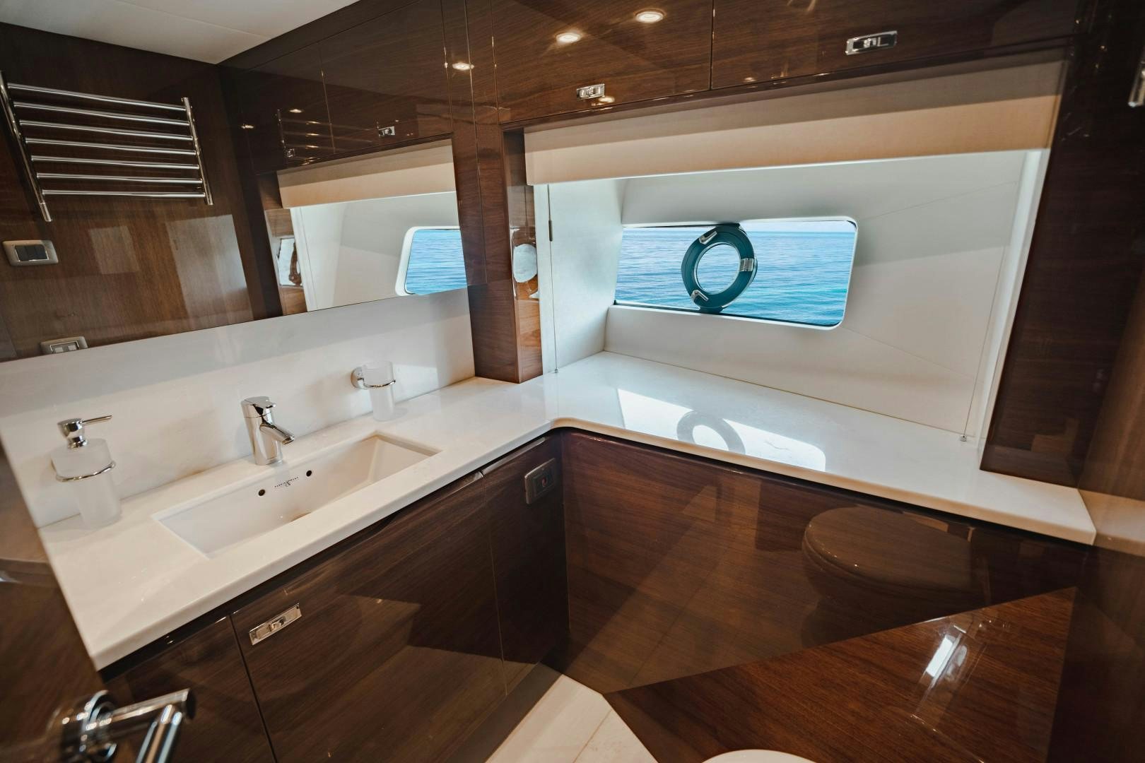 a bathroom with a large mirror aboard KAOS Yacht for Sale