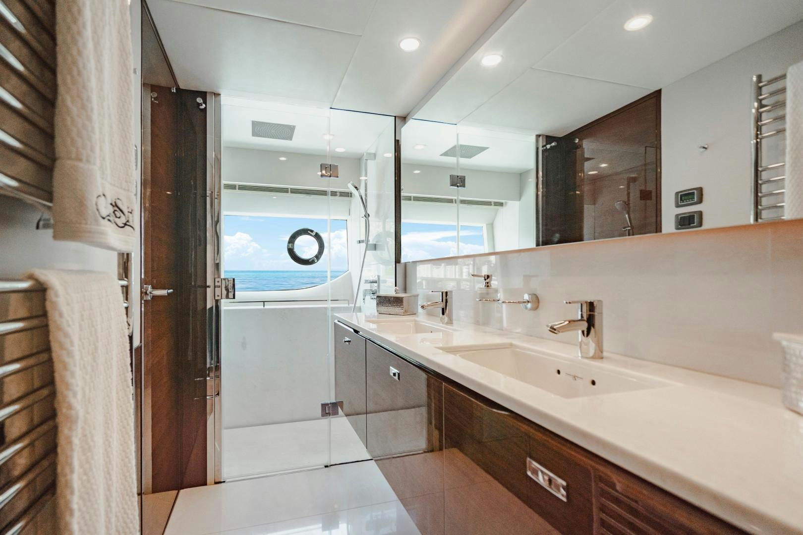 a bathroom with a large mirror aboard KAOS Yacht for Sale