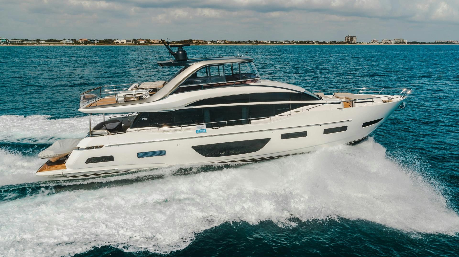 a white yacht on the water aboard KAOS Yacht for Sale