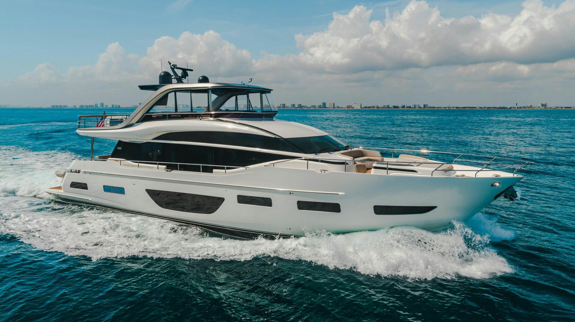 a white yacht on the water aboard KAOS Yacht for Sale