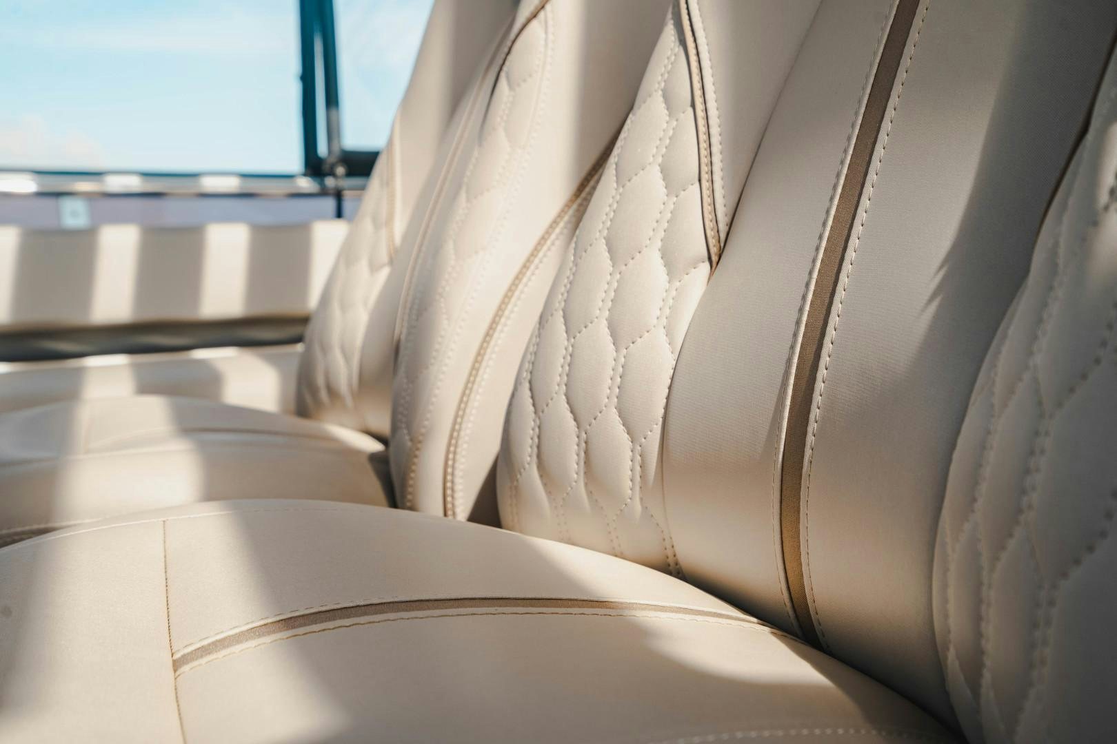 a close-up of a couch aboard KAOS Yacht for Sale