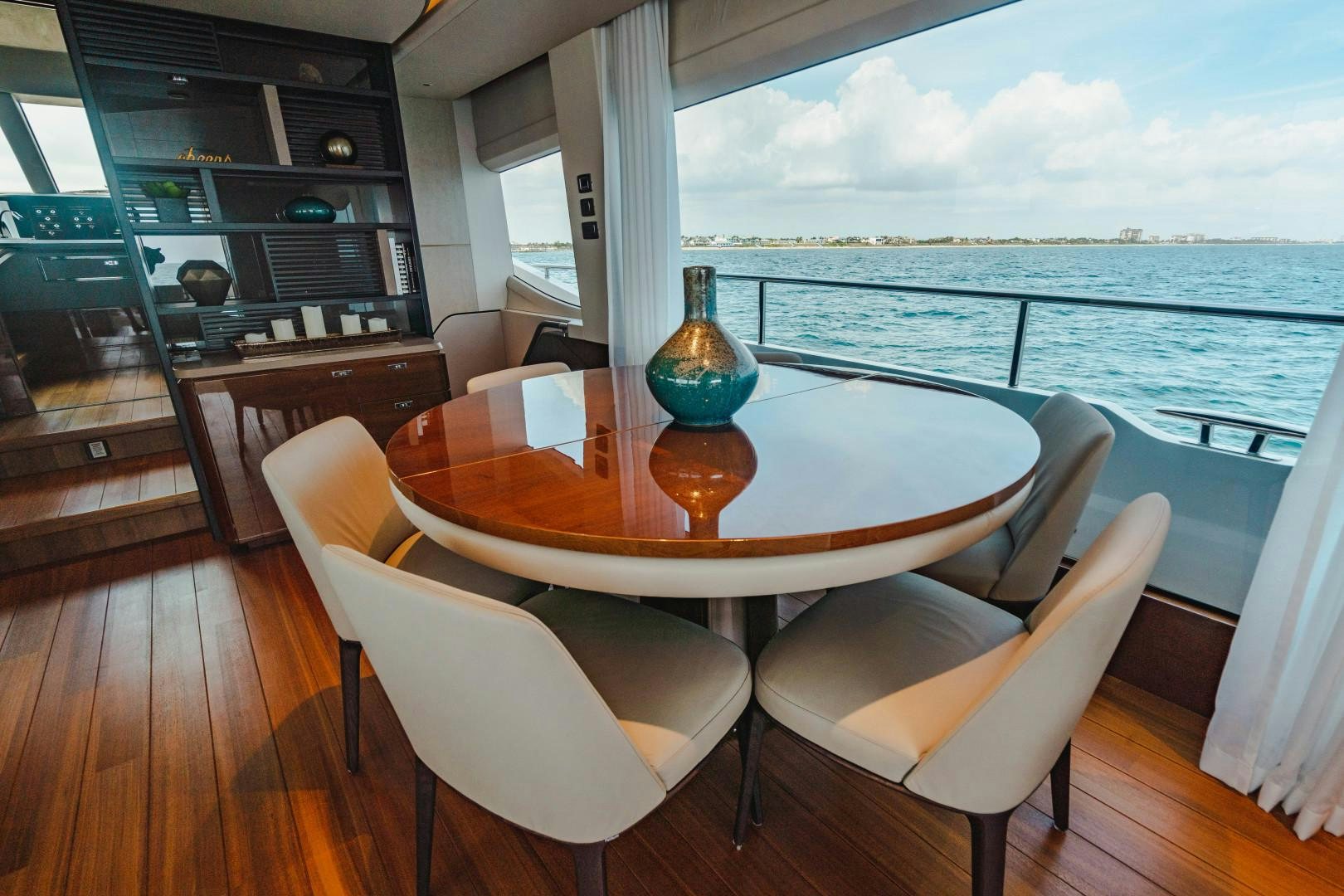 a table with chairs around it aboard KAOS Yacht for Sale