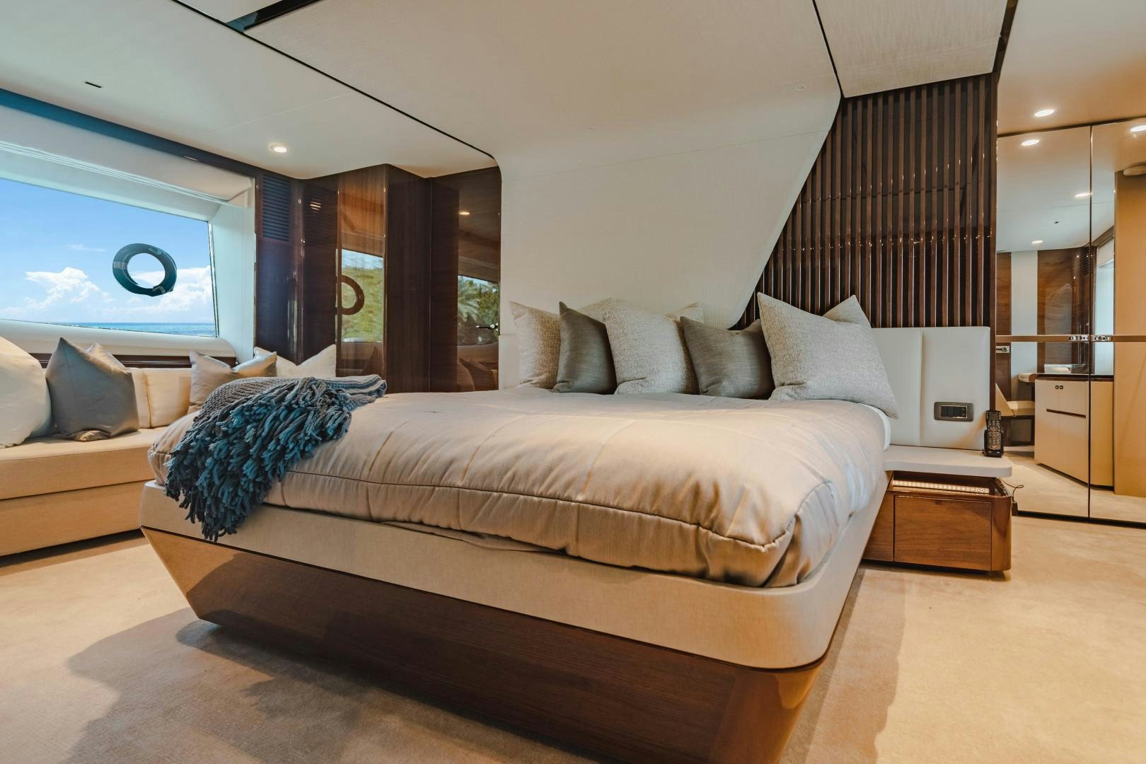 a large bed in a room aboard KAOS Yacht for Sale