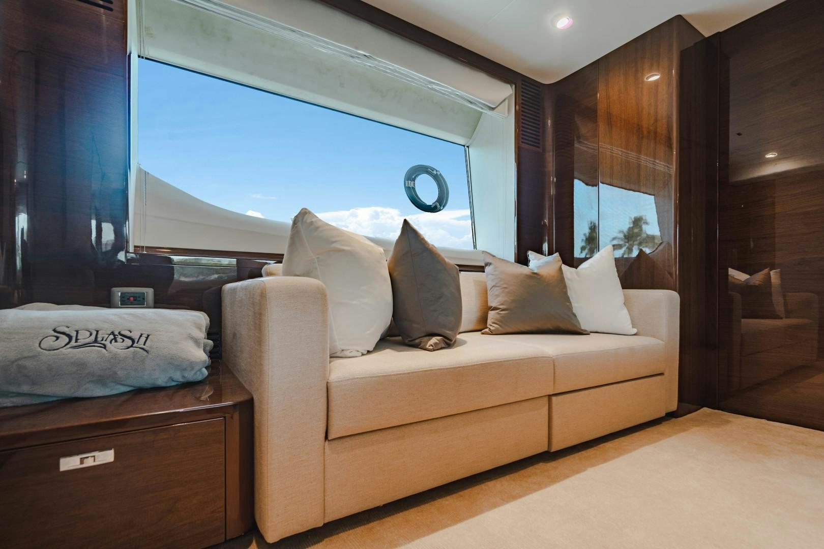 a living room with a large window aboard KAOS Yacht for Sale