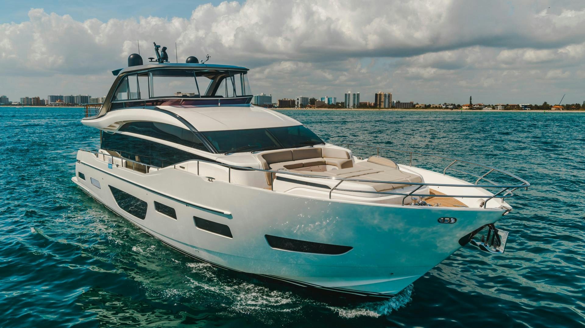 a white boat in the water aboard KAOS Yacht for Sale