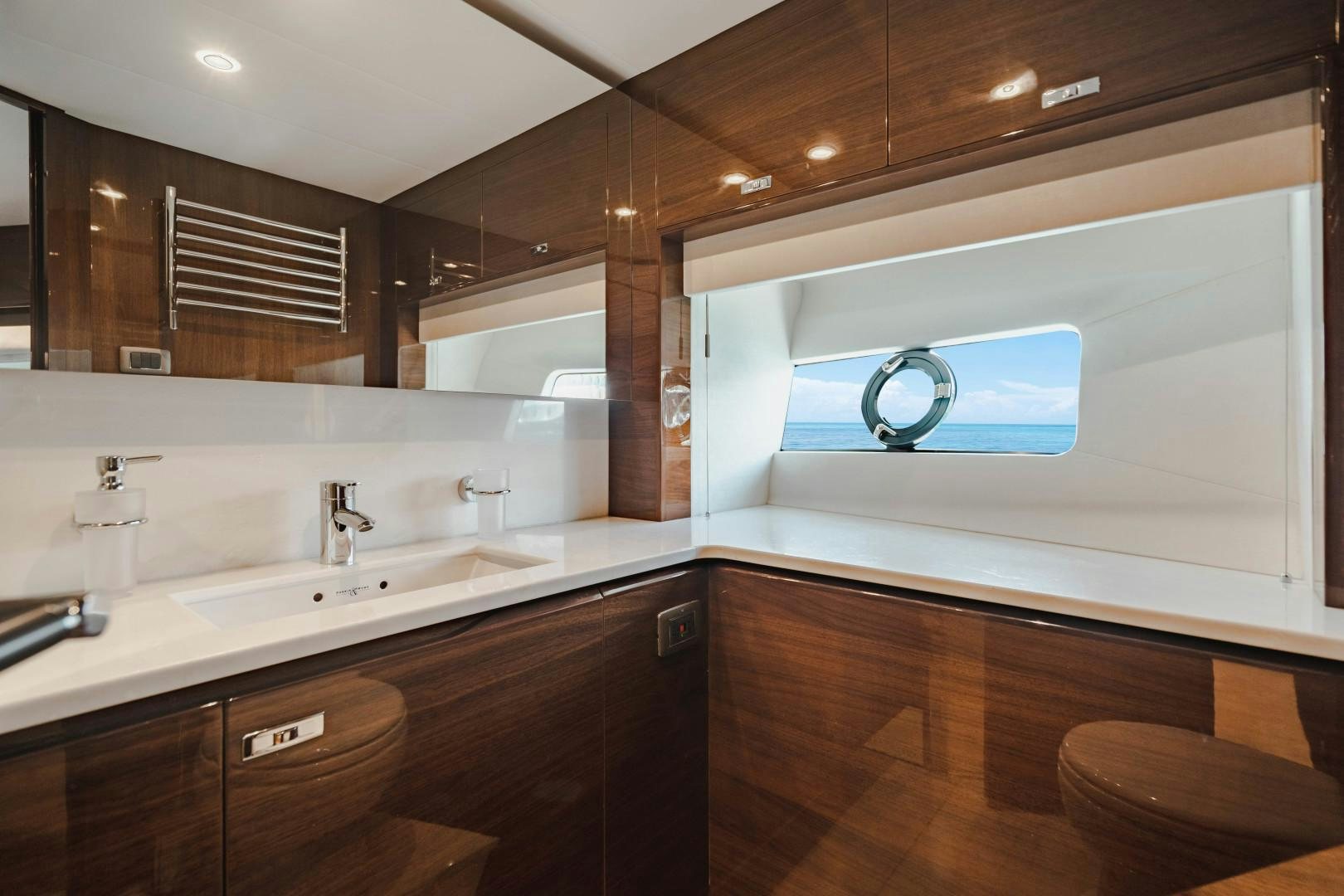 a bathroom with a large mirror aboard KAOS Yacht for Sale