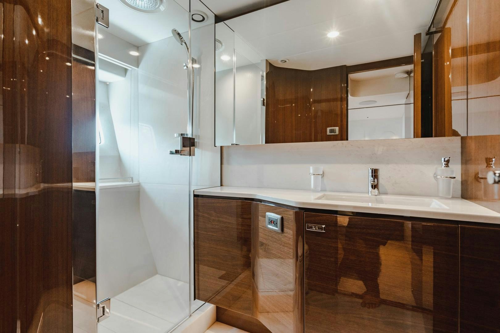 a bathroom with a large mirror aboard KAOS Yacht for Sale