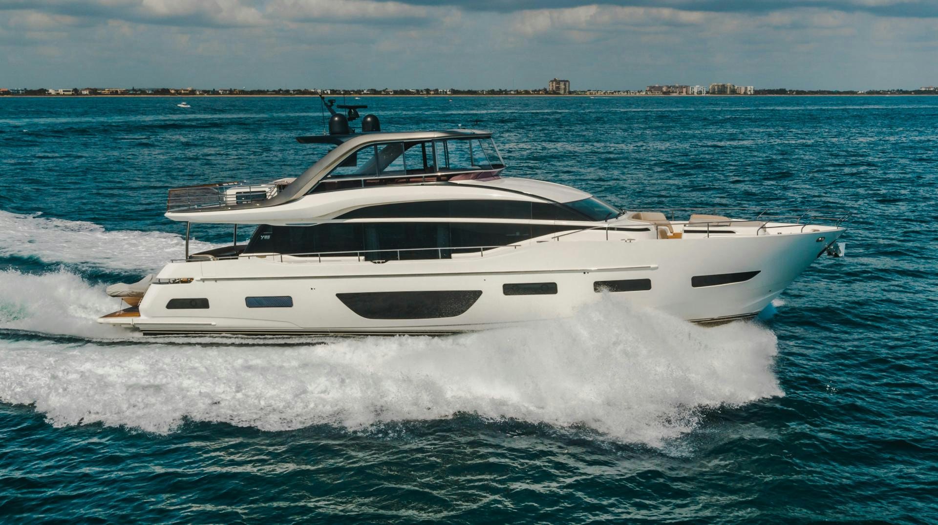 a white yacht in the water aboard KAOS Yacht for Sale