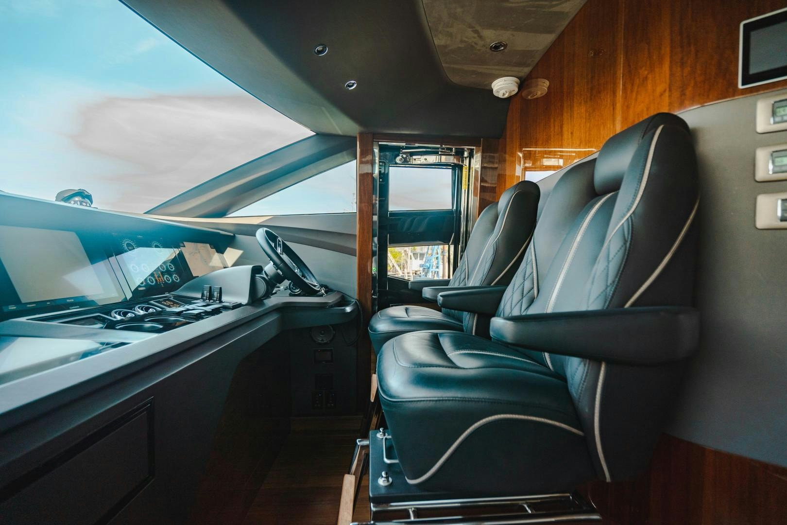 a seat with a seat and a desk with a computer on it aboard KAOS Yacht for Sale