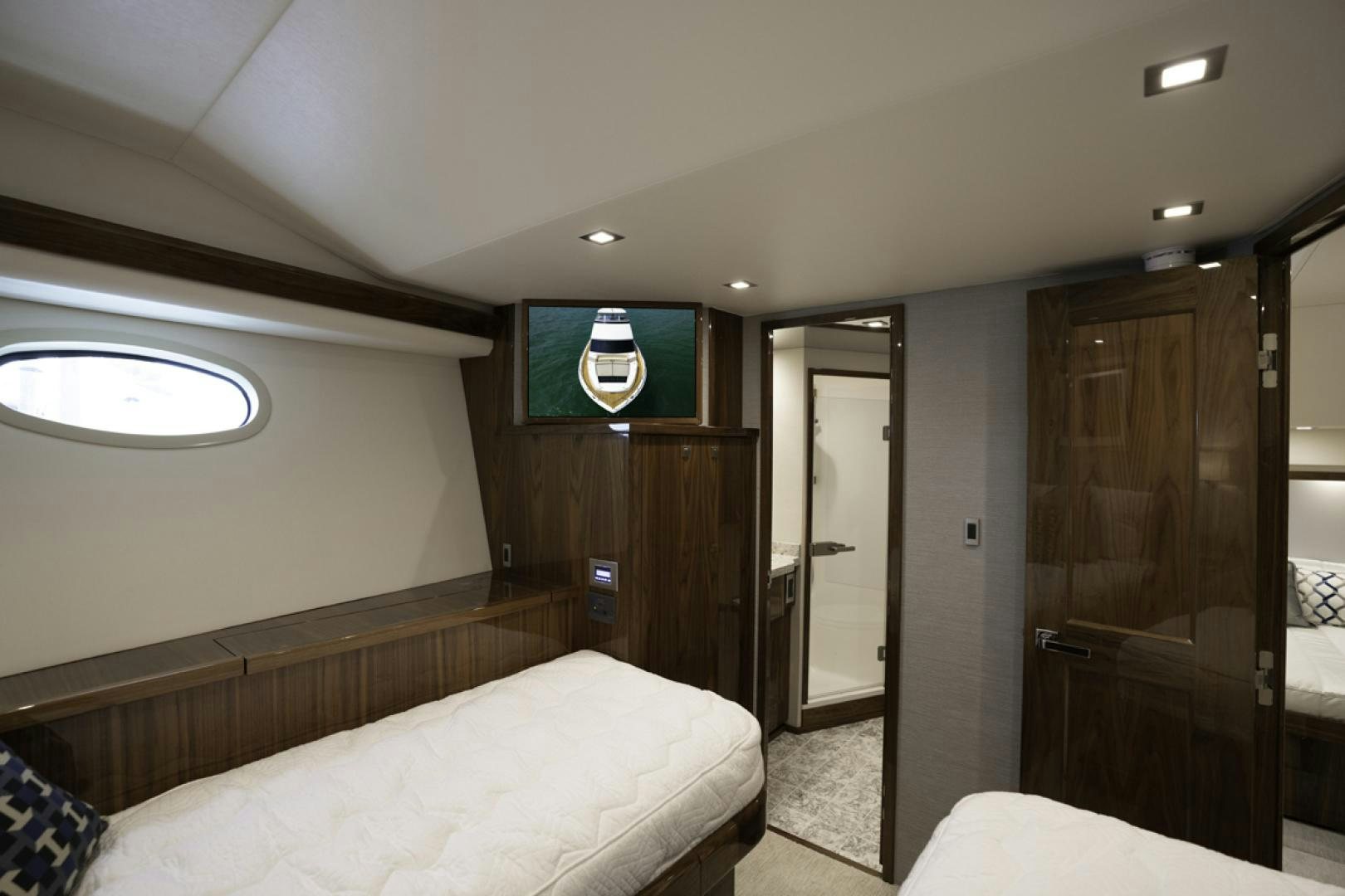 a room with a bed and a door aboard MAKE  HAPPEN Yacht for Sale