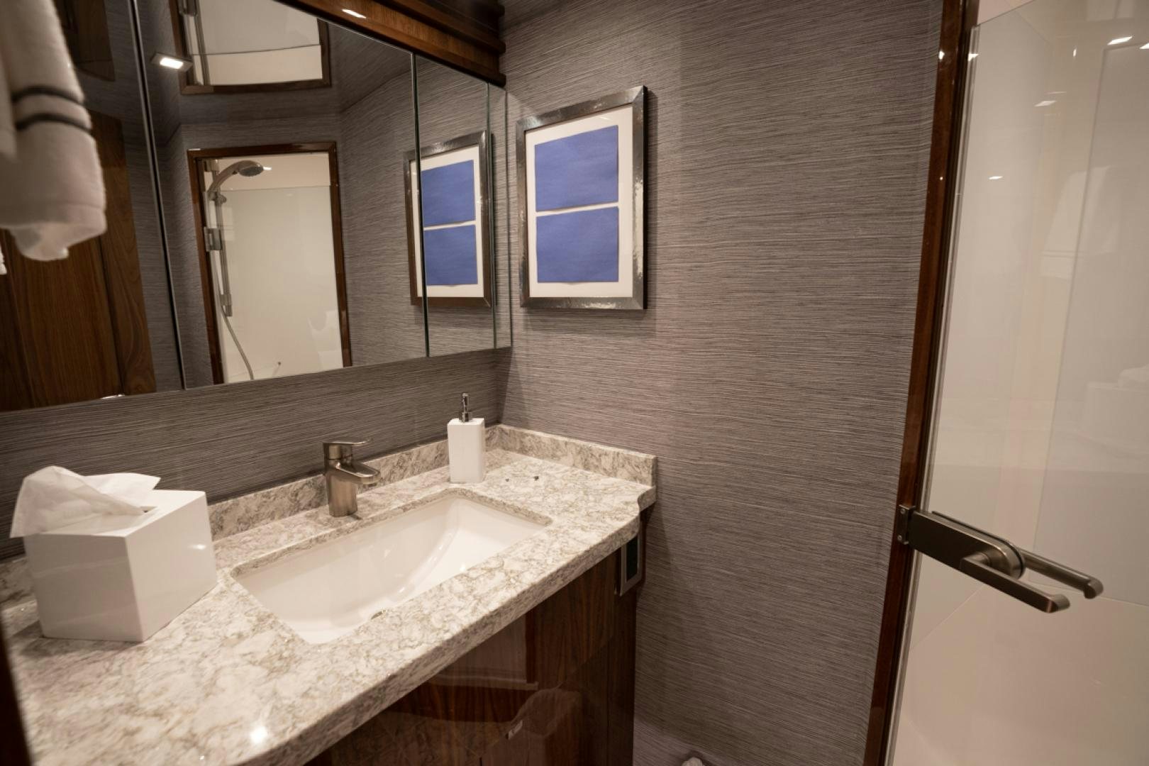 a bathroom with a sink and mirror aboard MAKE  HAPPEN Yacht for Sale