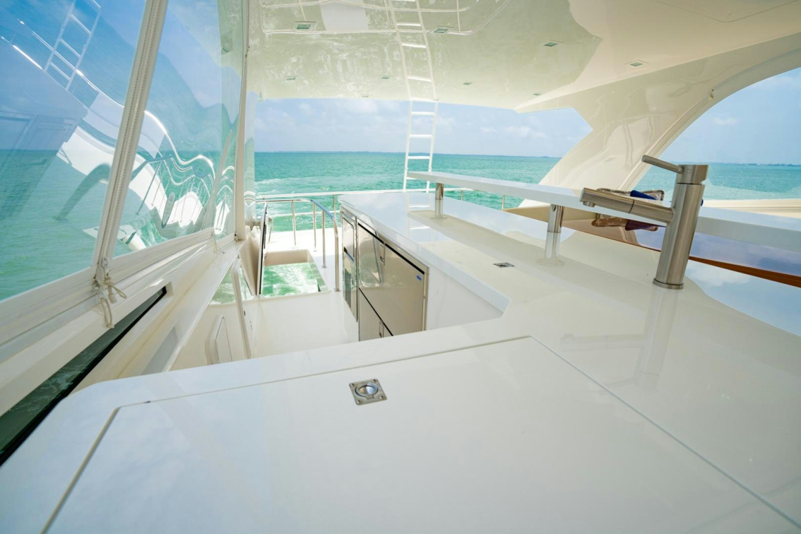 a room with a glass wall and a pool aboard MAKE  HAPPEN Yacht for Sale