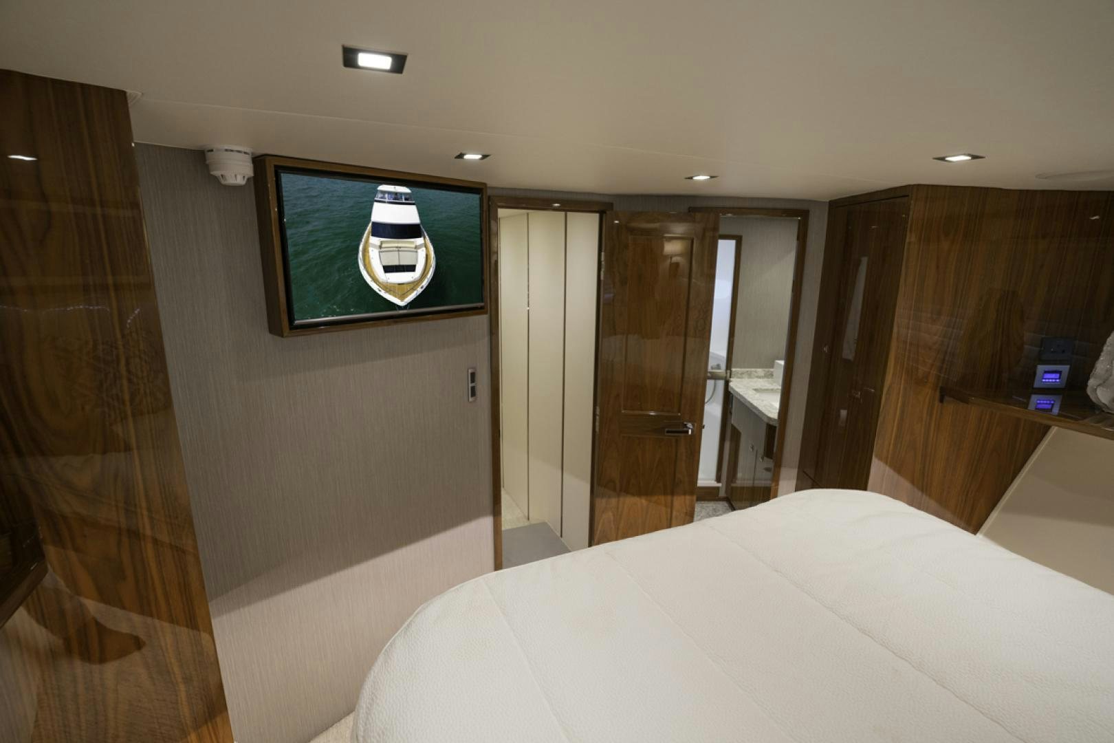 a hotel room with a bed and a television aboard MAKE  HAPPEN Yacht for Sale