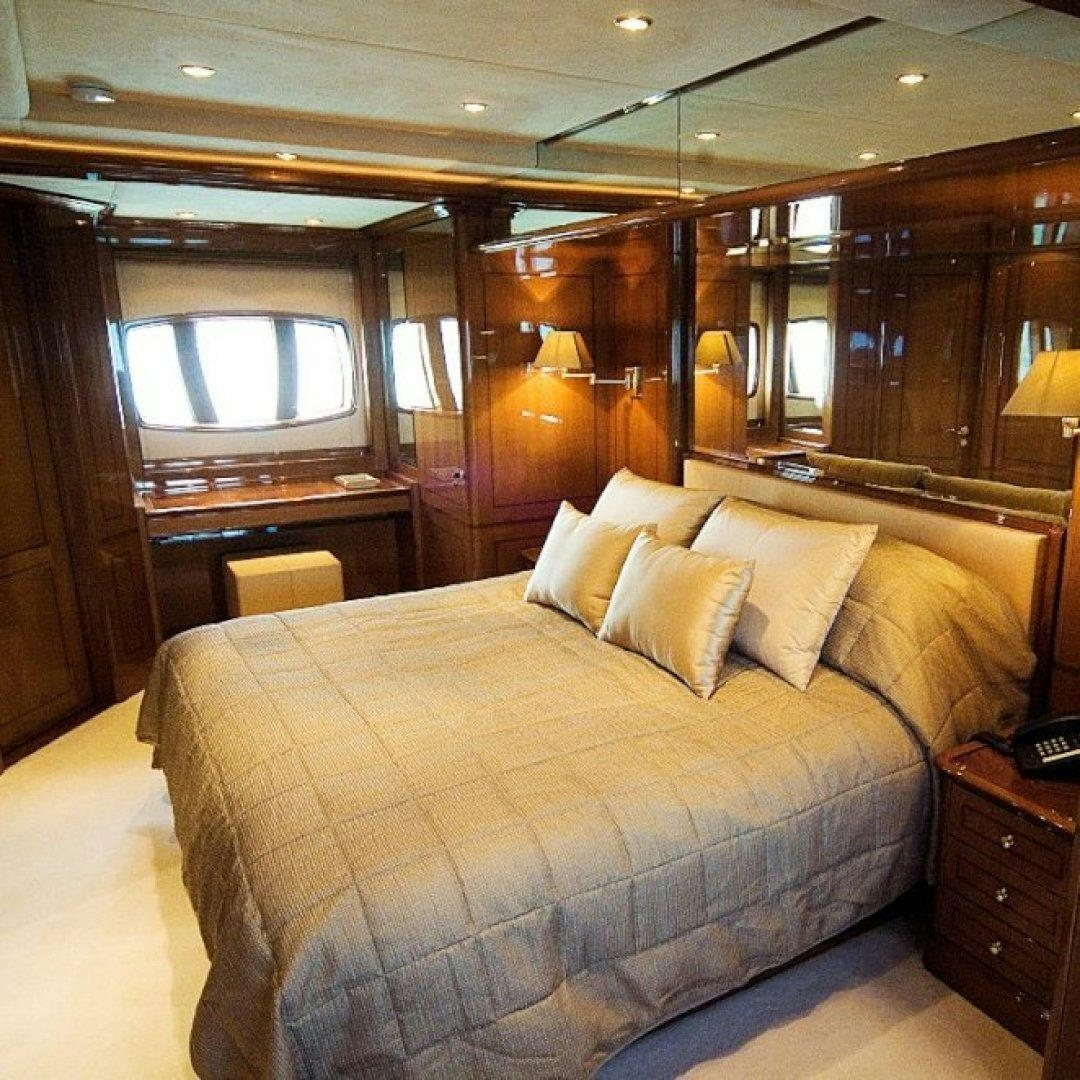 a bed in a room aboard FARFALLINA Yacht for Sale