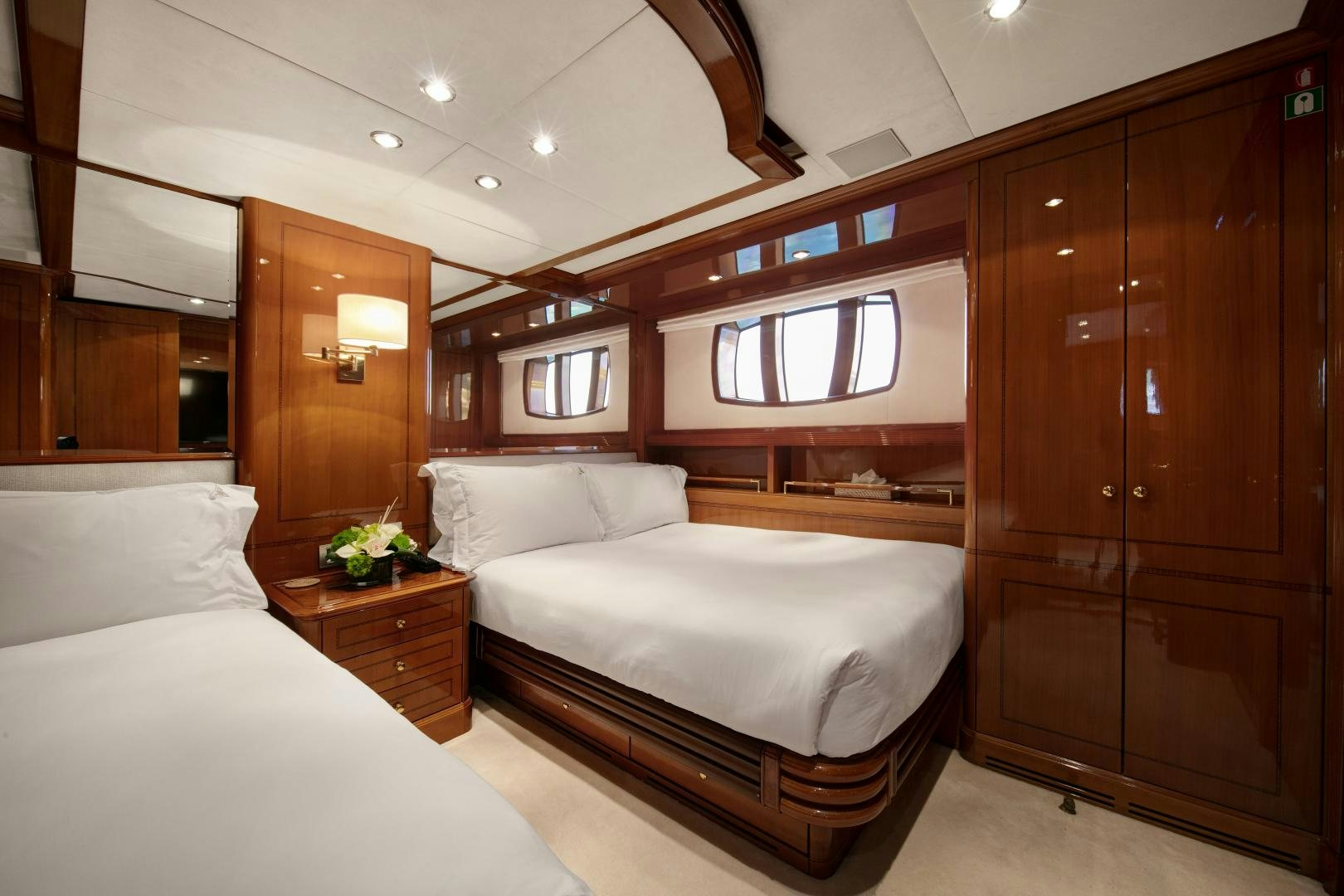 a room with a bed and a closet aboard FARFALLINA Yacht for Sale