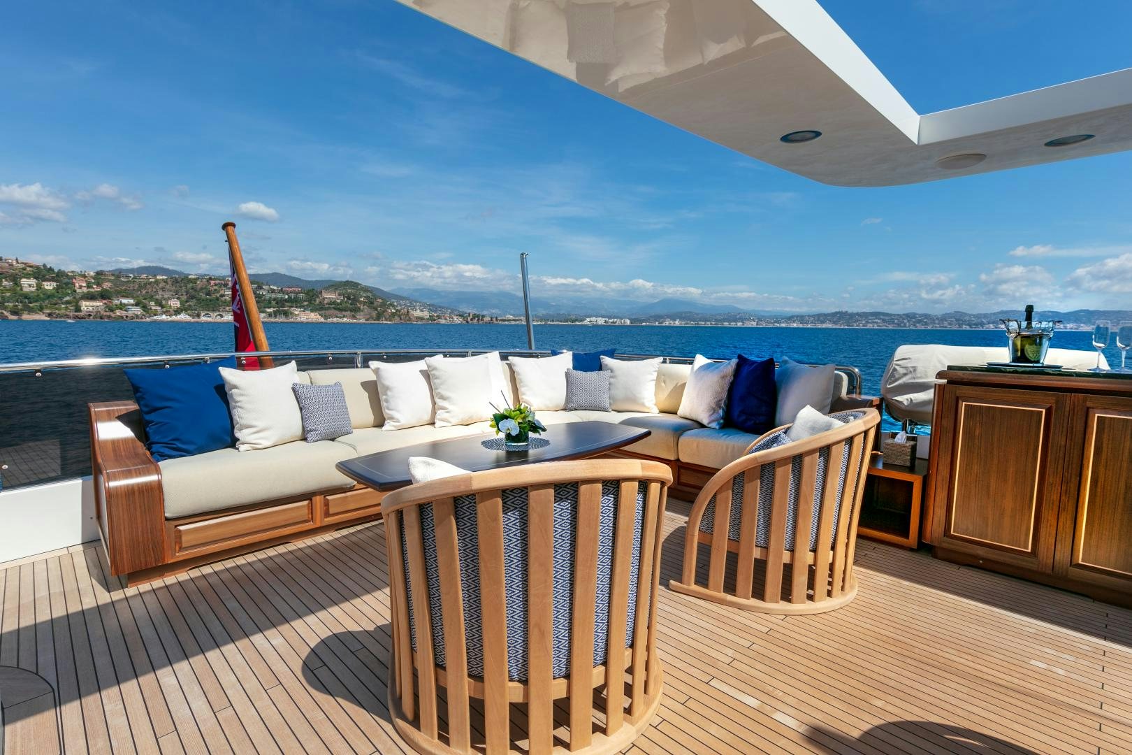a large living room with a large patio and a large blue sky aboard FARFALLINA Yacht for Sale