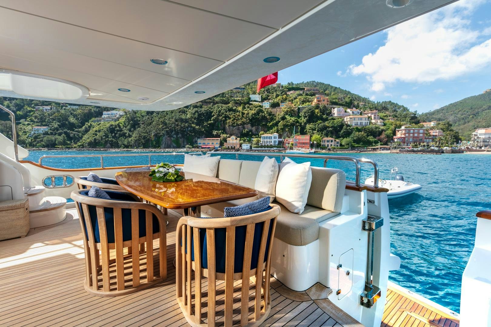 a table and chairs on a boat aboard FARFALLINA Yacht for Sale