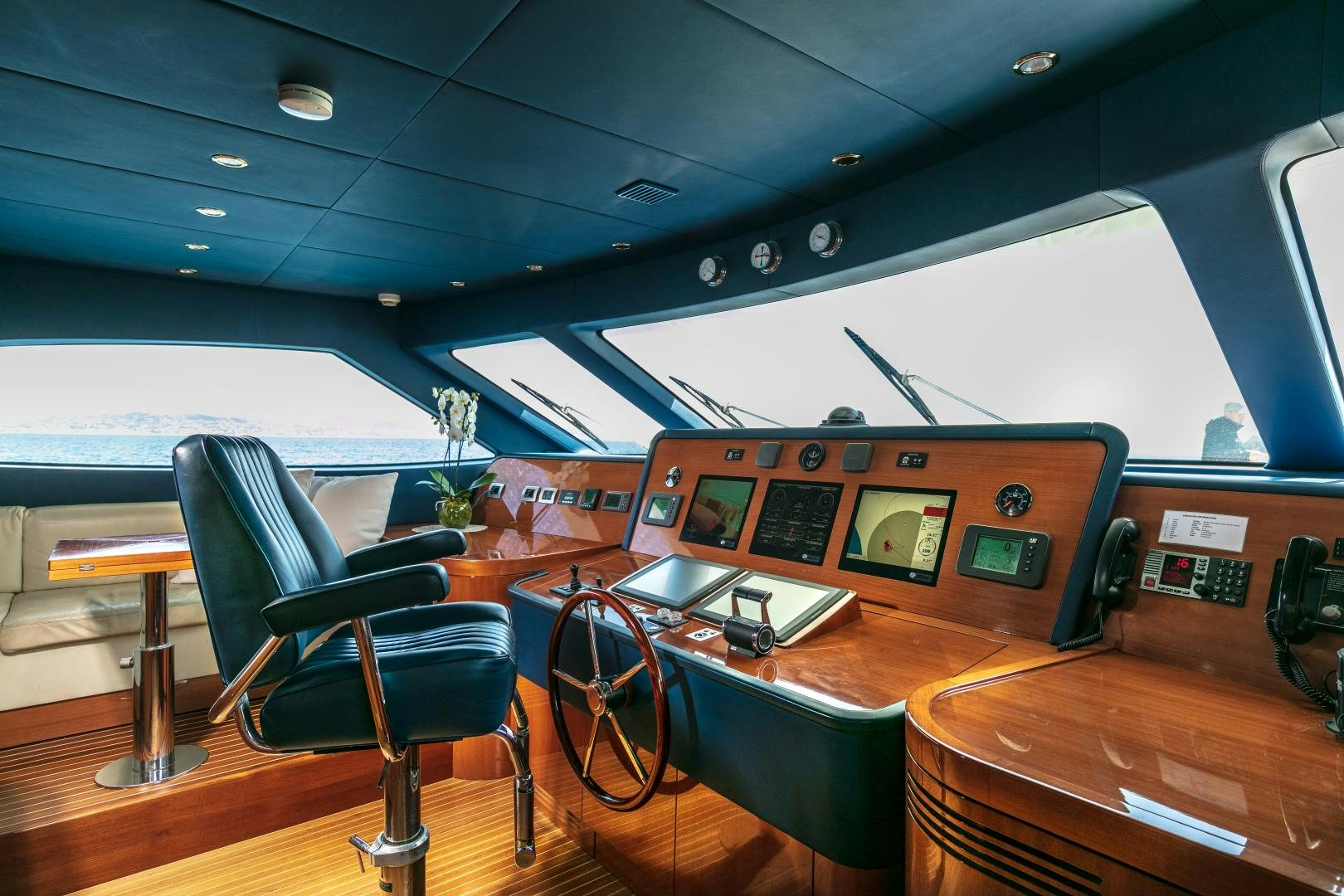 a room with a table and chairs aboard FARFALLINA Yacht for Sale