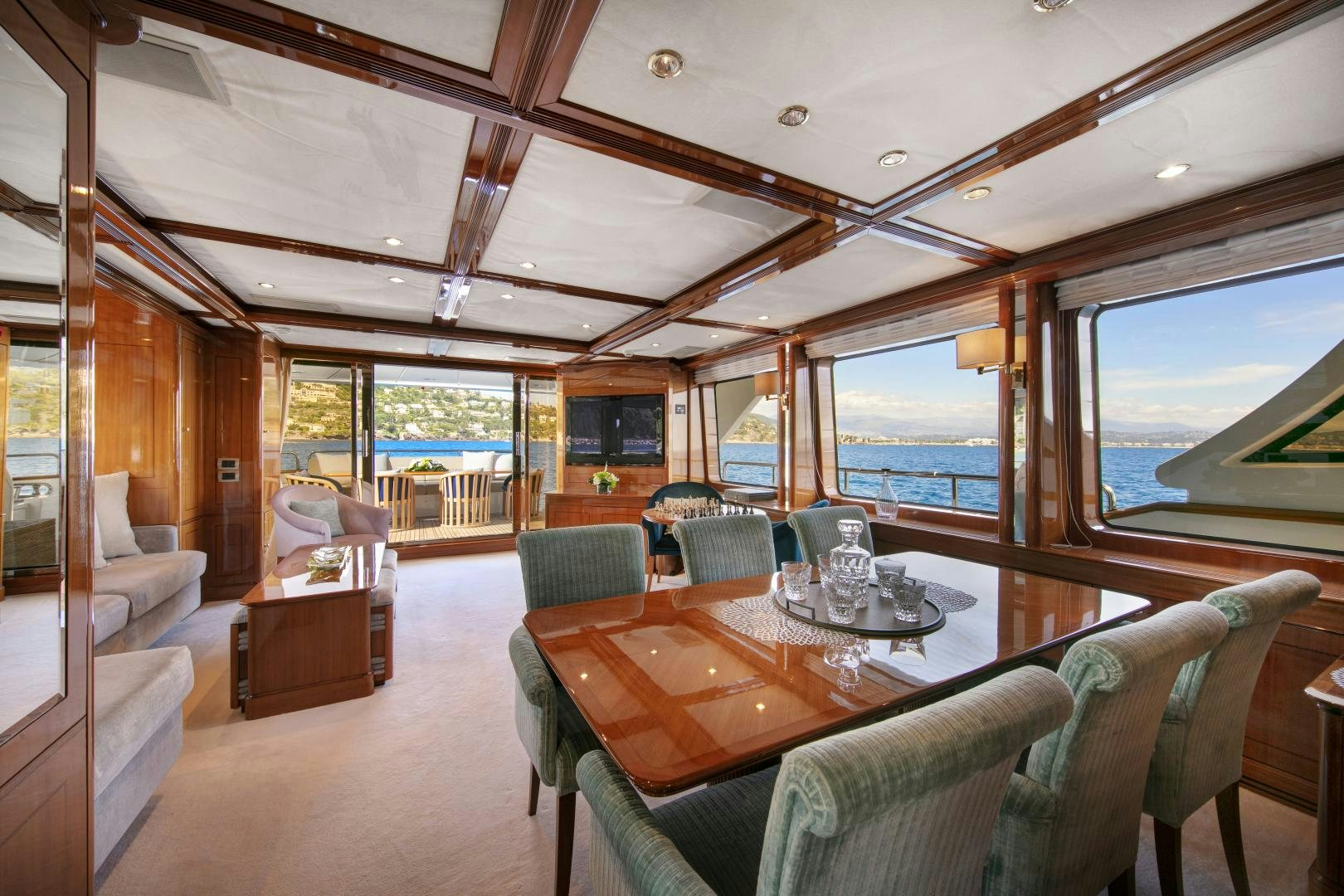 a large living room with a large window aboard FARFALLINA Yacht for Sale