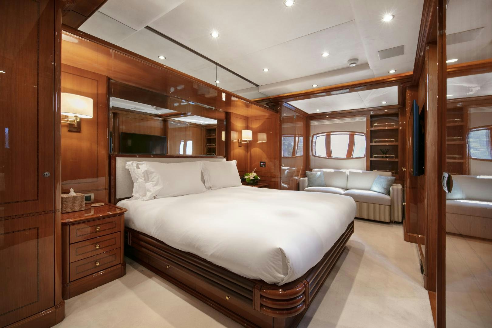 a large bed in a room aboard FARFALLINA Yacht for Sale