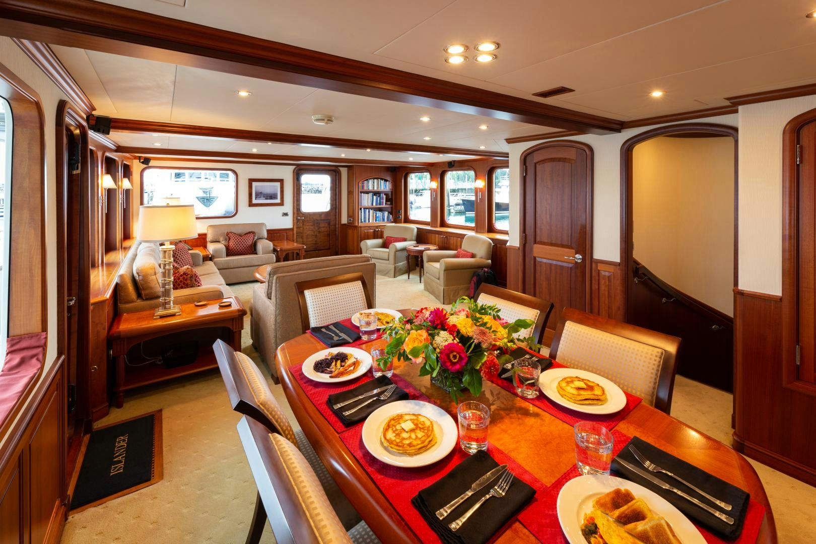 a dining room with a table and chairs aboard ISLANDER Yacht for Sale
