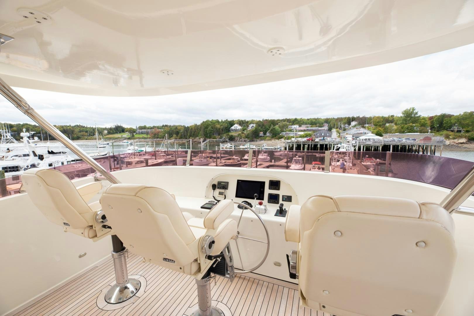 a white boat with a white canopy aboard ISLANDER Yacht for Sale