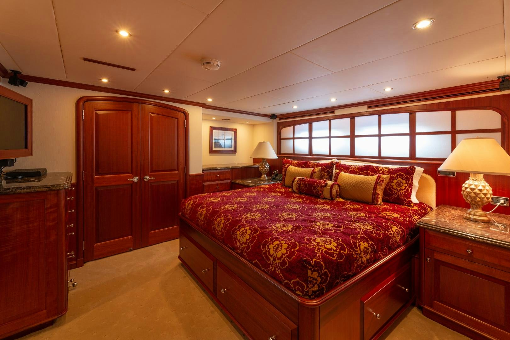 a large bedroom with a large bed aboard ISLANDER Yacht for Sale