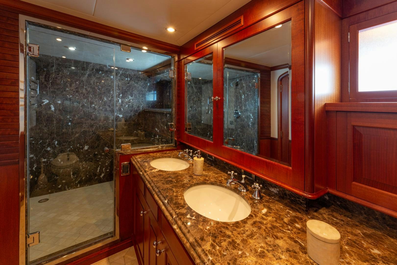 a bathroom with a large glass shower aboard ISLANDER Yacht for Sale