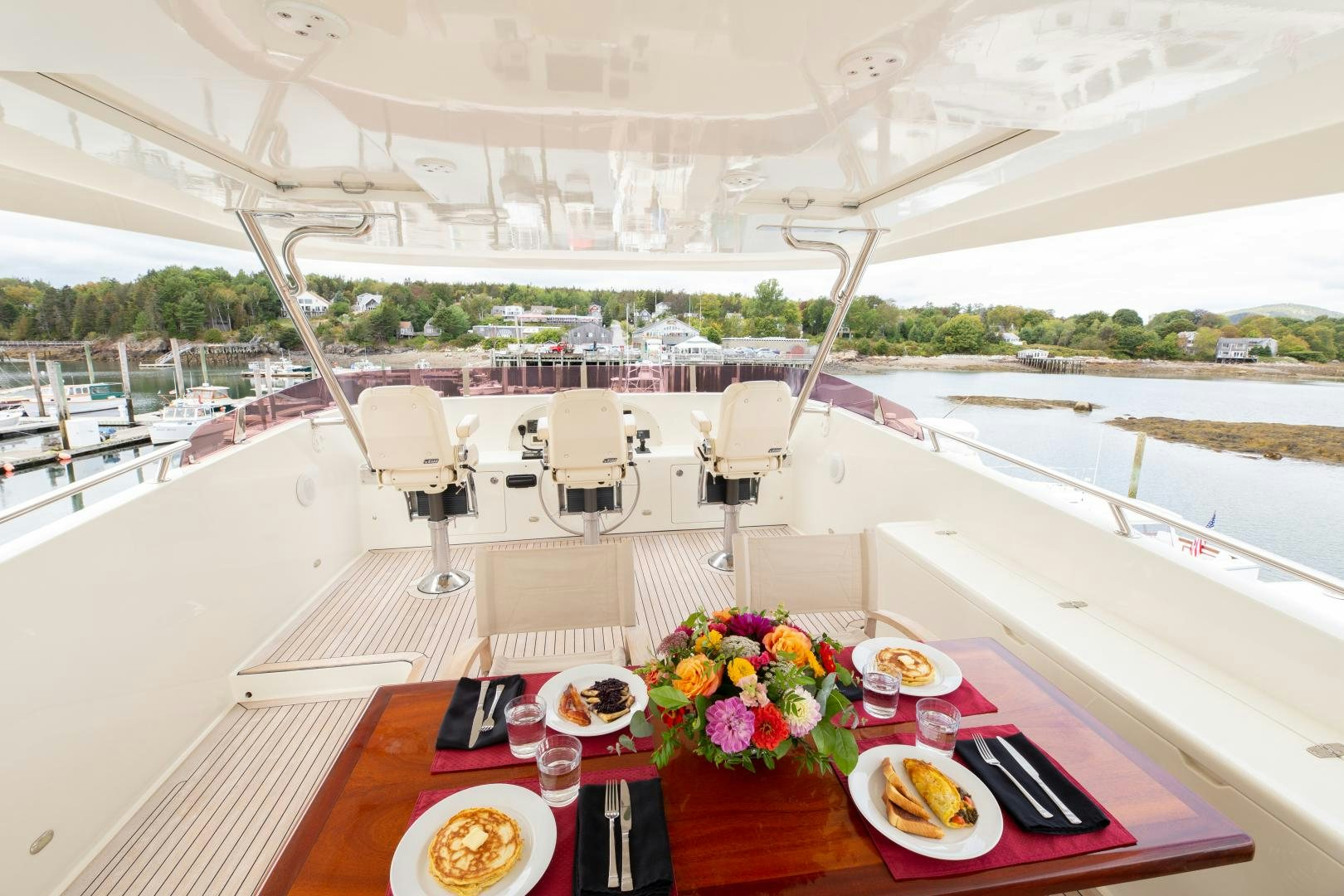 a table with plates and food on it aboard ISLANDER Yacht for Sale