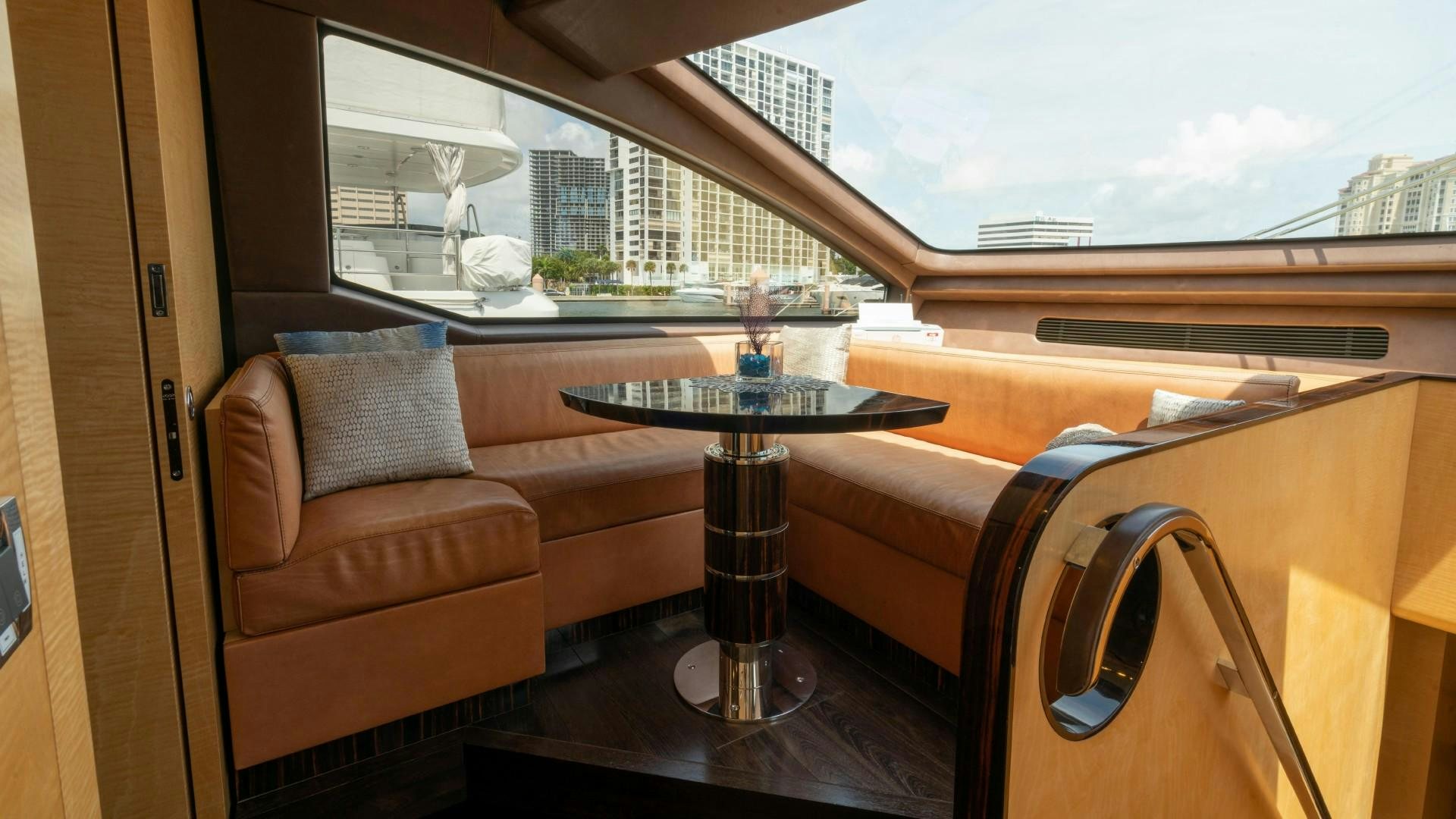 a table and chairs in a room aboard PHOENIX Yacht for Sale